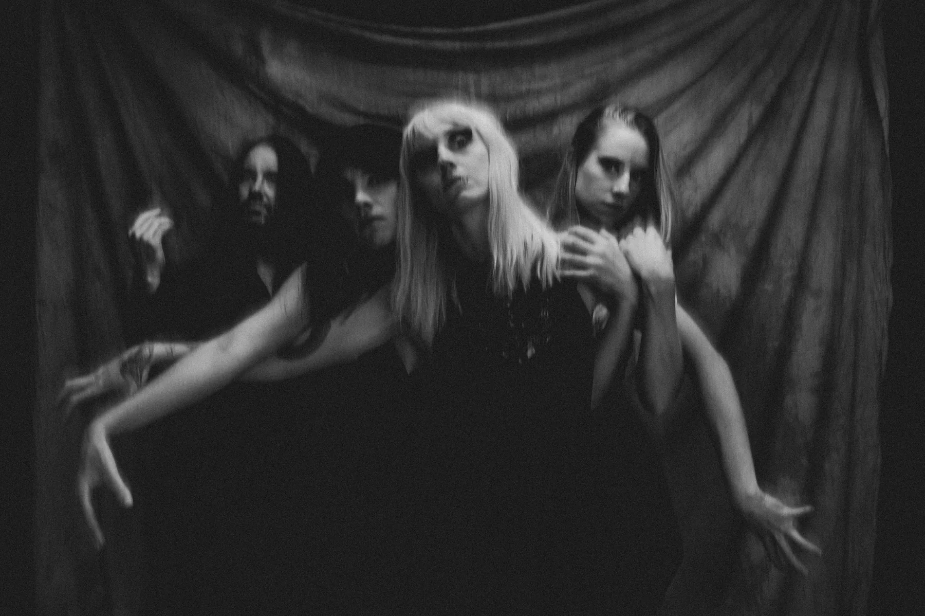 Crimson Veil together in a black-and-white portrait